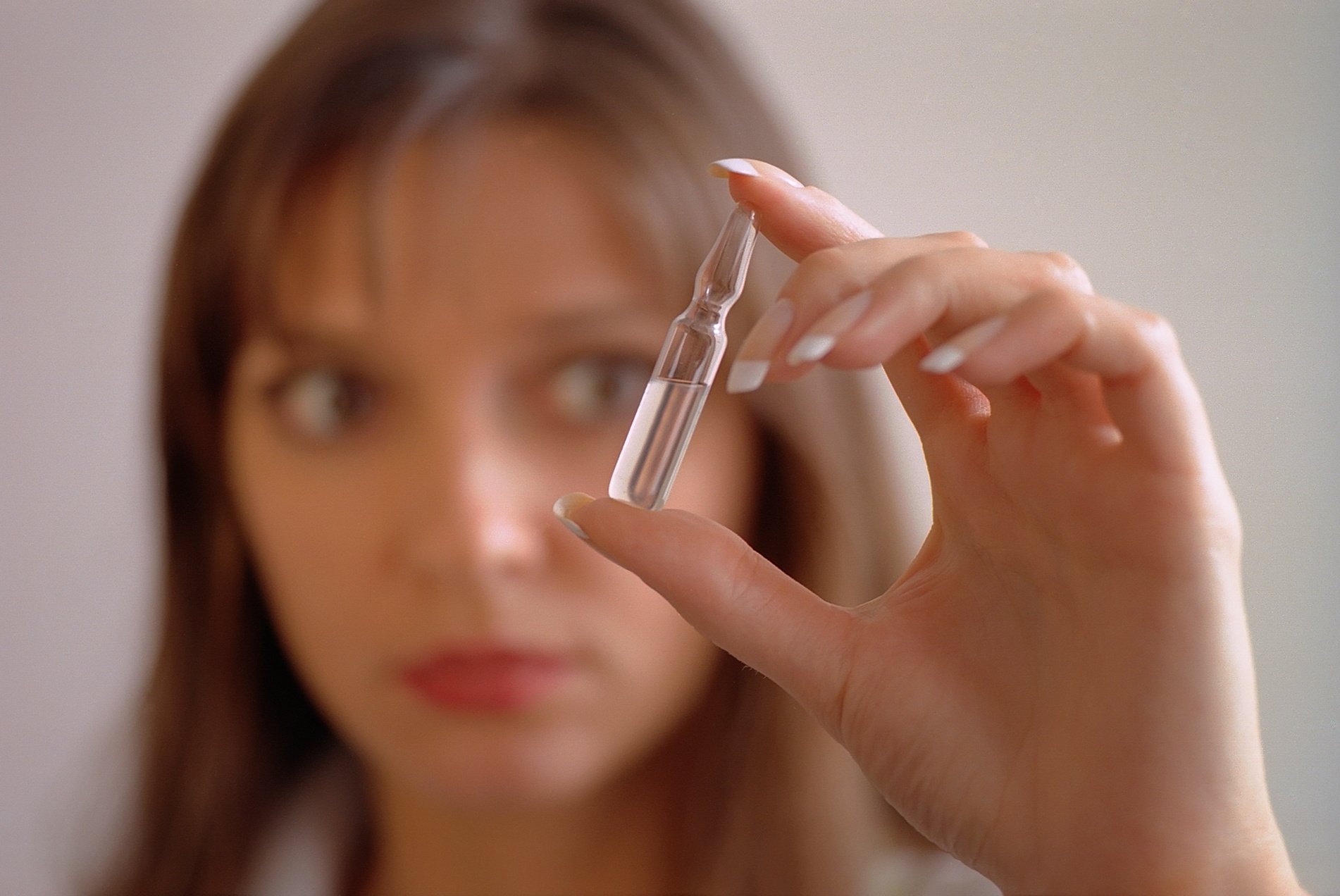 Woman Holding Silver Tube Type Vape